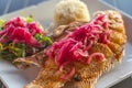 Fried fish platter in Mexico, with rice, vegetables and red onion Royalty Free Stock Photo