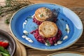 Fried fish rissole served with beetroot on blue plate on wooden table Royalty Free Stock Photo