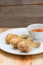 Fried fish sauce marinated chicken drumstick and sauce on white Royalty Free Stock Photo