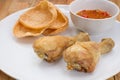 Fried fish sauce marinated chicken drumstick and sauce on white Royalty Free Stock Photo