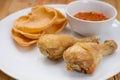 Fried fish sauce marinated chicken drumstick and sauce on white Royalty Free Stock Photo