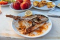 Fried fish skeleton in a plate Royalty Free Stock Photo