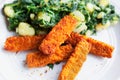 Fried fish sticks, crunchy and golden served with Swiss chard and potatoes Royalty Free Stock Photo