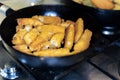Fried fish sticks-fingers in a pan close-up Royalty Free Stock Photo