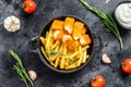 Fried Fish Sticks with French Fries. Fish Fingers. British fish and chips, fried potato. Black background. Top view Royalty Free Stock Photo