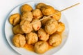 Fried fishballs and sweet sauce.