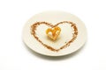 Fried flower decorated with heart-shaped cinnamon Royalty Free Stock Photo