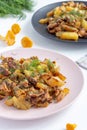 Fried forest chanterelle mushrooms with potatoes Cantharellus cibarius