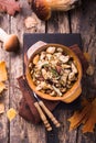 Fried forest mushrooms, boletus, onions. Rustic dish in a frying pan, vegetarian autumn food on top of view