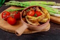 Fried french potato with mushrooms fresh green asparagus and tomatoes Royalty Free Stock Photo