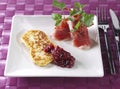 Fried fresh cheese with cured ham and rapsberry ma