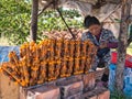 Fried frogs on sticks at a roadside stall near Phnom Penh in Cambodia