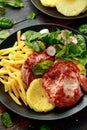 Fried Gammon steak with pineapple, french fries and vegetables Royalty Free Stock Photo