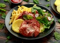 Fried Gammon steak with pineapple, french fries and vegetables Royalty Free Stock Photo