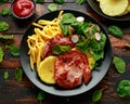 Fried Gammon steak with pineapple, french fries and vegetables Royalty Free Stock Photo