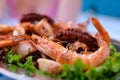 fried giant freshwater prawns on a dish in white background