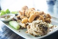 Fried Giant gourami fish with garlic and seafood sauce, Uthai T