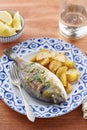 Fried gilt head bream with potatoes