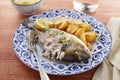 Fried gilt head bream with potatoes