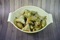 Fried glutinous rice wrap in palas leaf on wooden table background