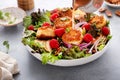 Fried goat cheese salad with apples and raspberries and vinaigrette dressing