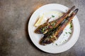 Fried goby fish on plate, close-up