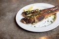 Fried goby fish on plate, close-up