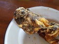 Fried goby placed on an antique plate.Use for website/banner background