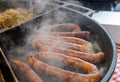 Fried or grilled sausages and stew cabbage at Wroclaw christmas market Royalty Free Stock Photo