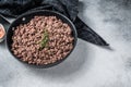 Fried ground mince beef and pork meat in a pan with herbs. White background. Top view. Copy space