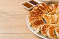 fried gyoza or dumplings snack with soy sauce Royalty Free Stock Photo