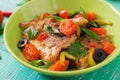 Fried hake fillet with tomato and olives Royalty Free Stock Photo