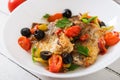 Fried hake fillet with tomato and olives Royalty Free Stock Photo