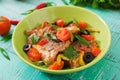 Fried hake fillet with tomato and olives Royalty Free Stock Photo