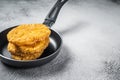 Fried Hash brown potato, hashbrown fritters in a skillet. White background. Top view. Copy space