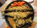 Fried herring with tomatoes /