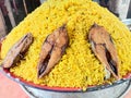 fried hilsa fish and rice on kitchen Royalty Free Stock Photo