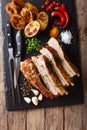 Fried homemade pork brisket with baked potatoes close-up on a ta Royalty Free Stock Photo