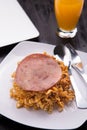 Fried Indonesian Noodle with ham and orange juice. Food while working Royalty Free Stock Photo