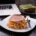 Fried Indonesian Noodle with ham and orange juice. Food while working Royalty Free Stock Photo