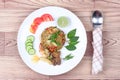 Fried jasmine rice in green curry with mixed meat.