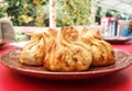 Fried khinkali on a red table Royalty Free Stock Photo