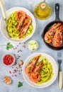 Fried king prawns with garlic, pepper, lime and parsley cilantro. Large shrimp. Langoustine. Delicious dinner with pasta tagliat Royalty Free Stock Photo