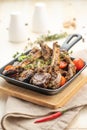 Fried lamb chops with fried onions, garlic and fresh herbs Royalty Free Stock Photo