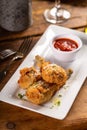 Fried lamb chops in parmesan batter with tomato sauce Royalty Free Stock Photo