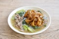 fried large noodle with slice beef meat and Chinese kale dressing gravy sauce on plate