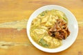 Fried large rice noodles dressing with chicken and vegetable in gravy sauce on plate Royalty Free Stock Photo