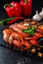 fried large tray appetizer crayfish, squid on black slate Royalty Free Stock Photo