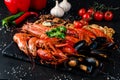 fried large tray appetizer crayfish, squid on black slate Royalty Free Stock Photo