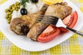 Fried legs with rice, pieces of tomatoes and green peas Royalty Free Stock Photo